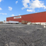 Thumbnail of http://Side%20view%20of%20Large%20Warehouse%20and%20yard