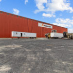 Thumbnail of http://Side%20view%20of%20large%20warehouse%20with%20trailer%20and%20yard